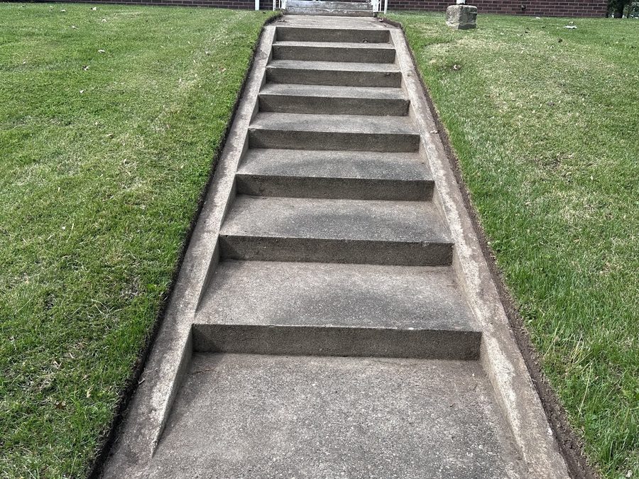 Precise edging along concrete steps and lawn